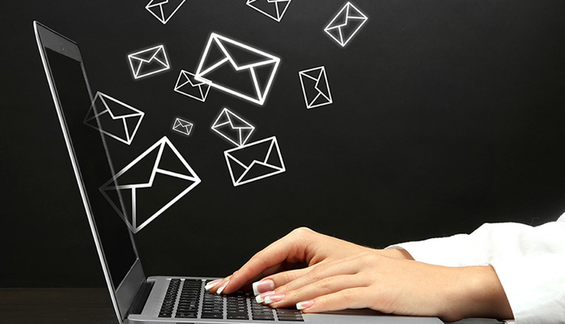 Woman emailing for article agency article titled, Your Guide to High ROI Email Marketing