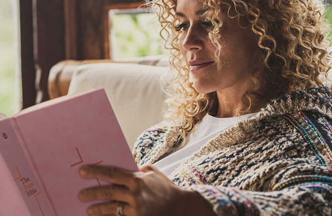 woman reading NIV Bible - NIV site Home page