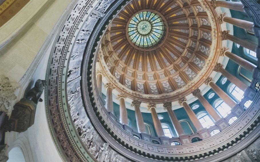 Dome interior of the Illinois State capital illustrating where Woodstock Institute works to lobby for economic justice.